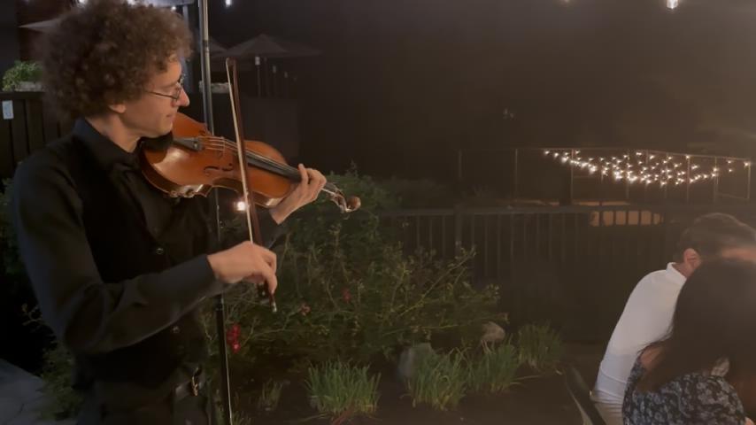 Violin and hibachi event atmosphere